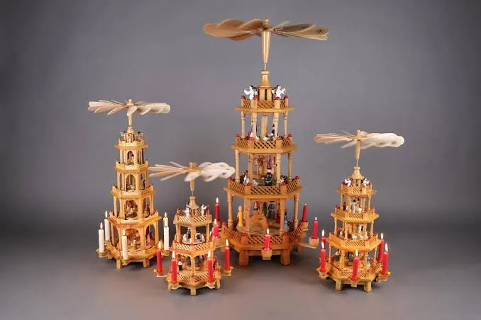 A hand-carved Christmas Pyramid with candle-lit tiers